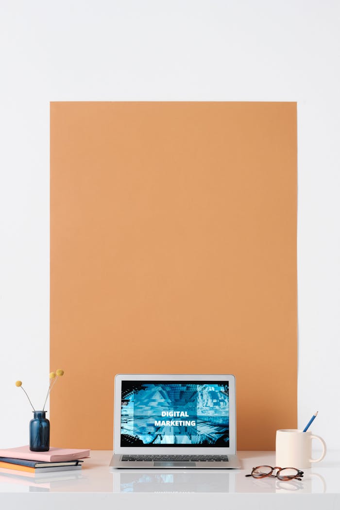 our-journey-02 Modern workspace featuring a laptop with a digital marketing screen, ideal for business and technology themes.